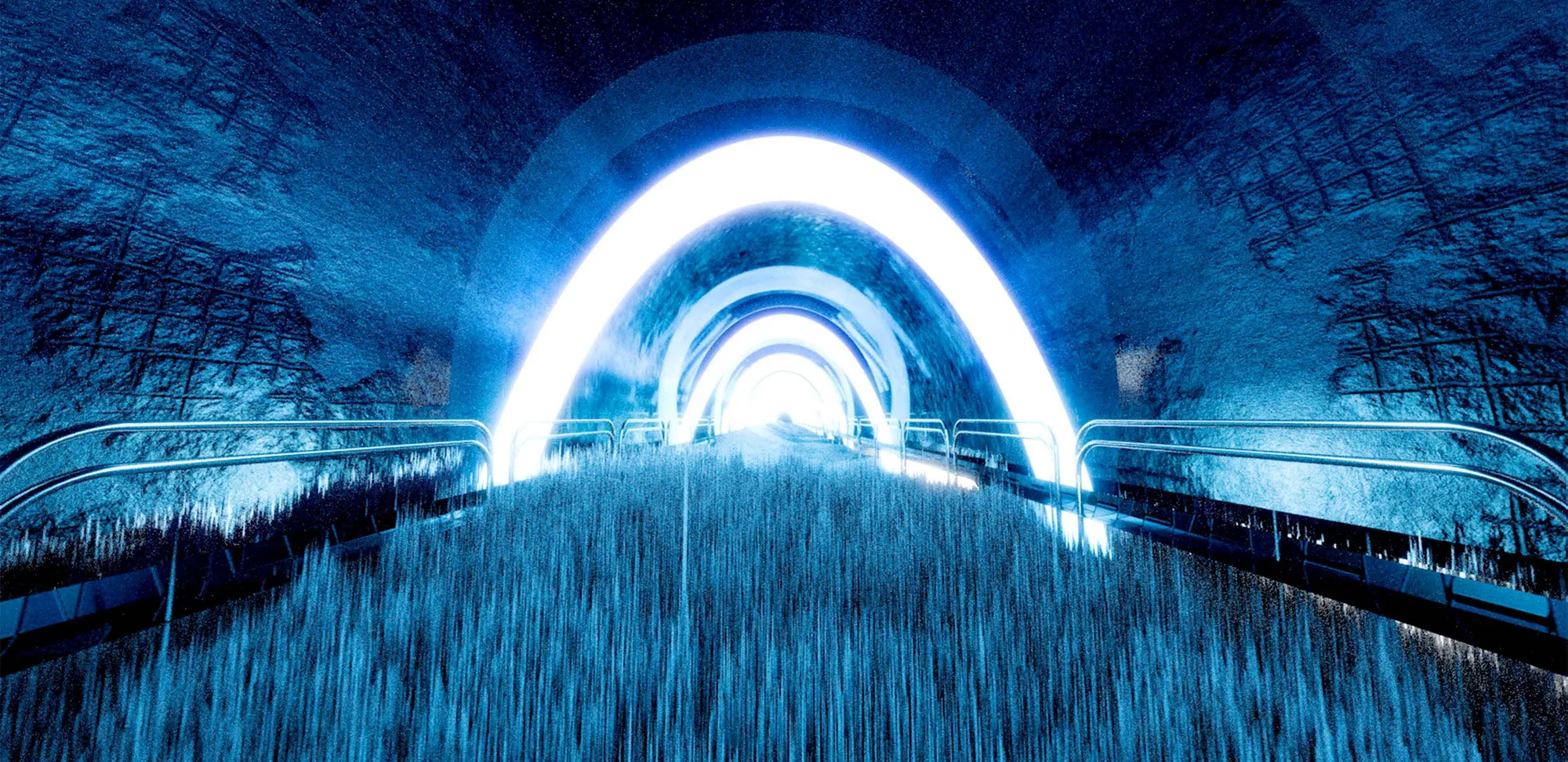 A tunnel of glowing white arches over a field of blue grass.